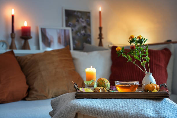 Cosy evening setting with soft lighting and herbal tea